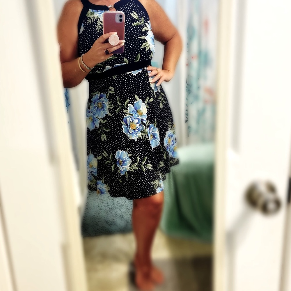 Navy dress with lighter blue flowers and green leaves.. size 8..